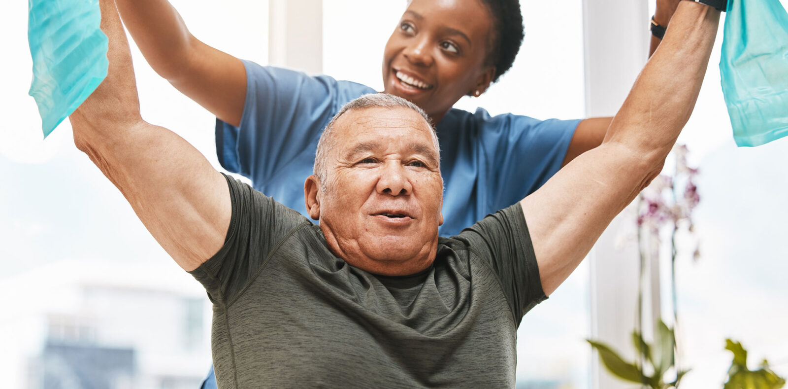 Physiotherapy help, stretching band and doctor with senior man in physical therapy, rehabilitation or healthcare support. Black woman chiropractor or physiotherapist consulting elderly patient